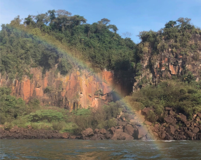 rainbow next to iguazu falls