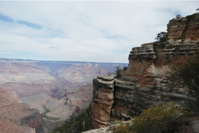 view of the grand canyon cliffs as seen from eye level on a trail
