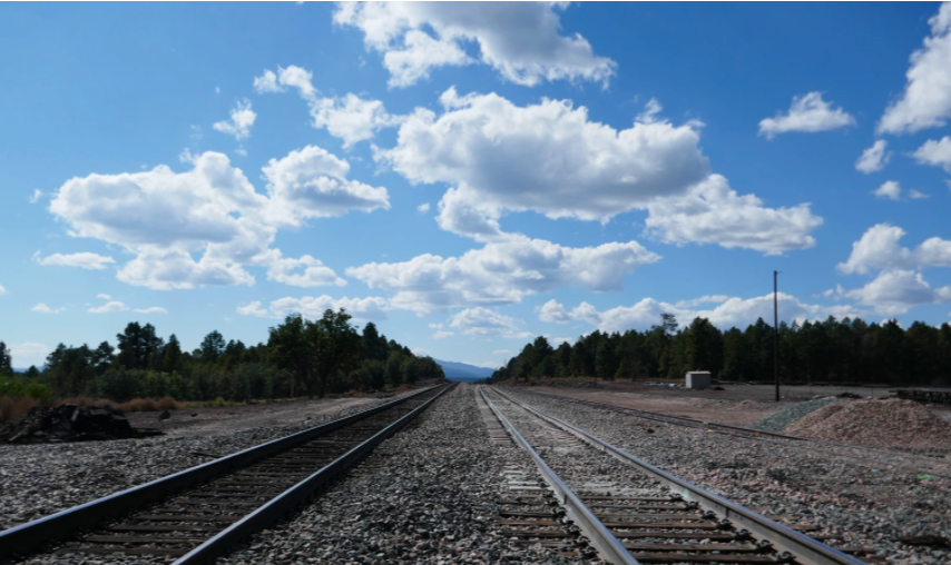 train tracks cutting through trees of south garland prairie