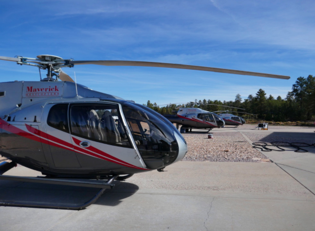 side view of a maverick helicopter parked on a takeoff landing