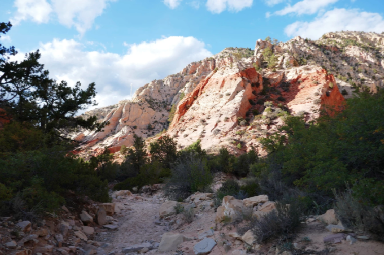 sun hitting the rocks of red hollow slot canyon