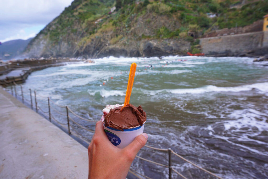 vanilla and chocolate gelato against the vernazza jetty