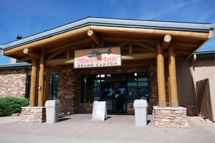 entrance to the maverick grand canyon helicopter site with wooden pillars and an overhang