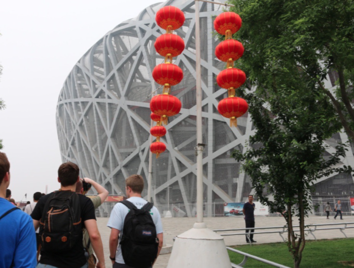 red lanterns hanging in front of the bird's nest
