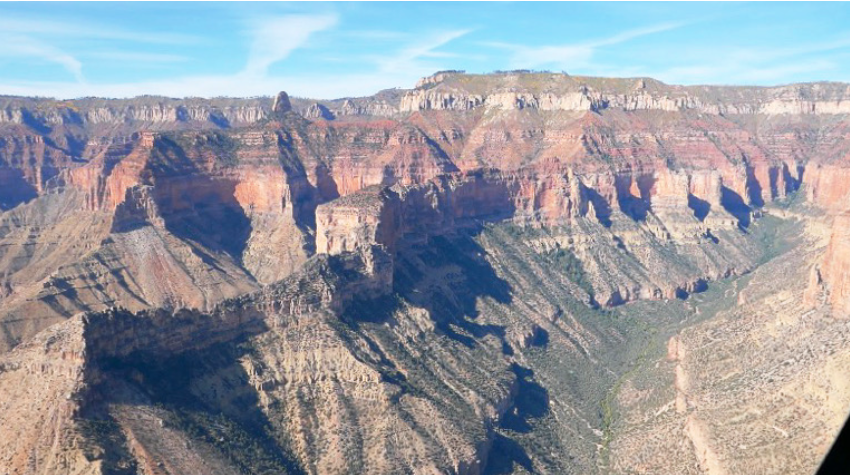multicolored side profile of a deep wall in the grand canyon
