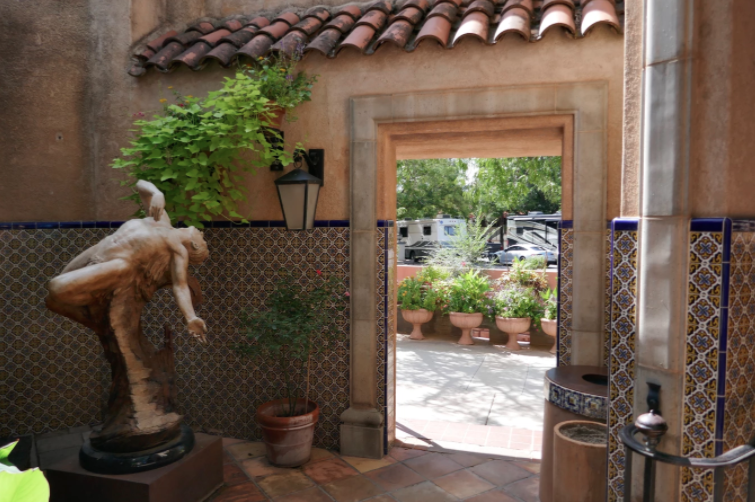 open air doorway with an art statue in tlaquepaque