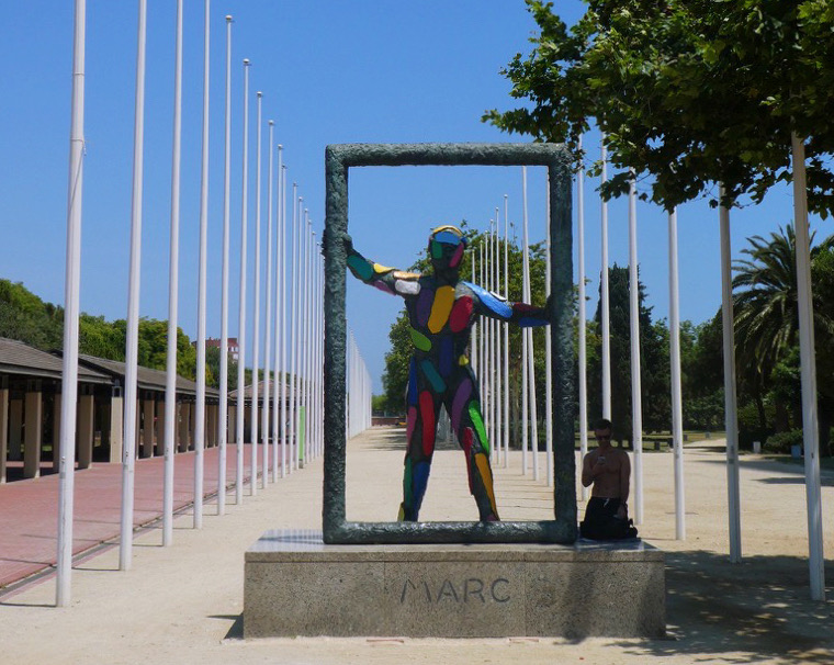 artistic statue of a colorful person in a frame in barcelona