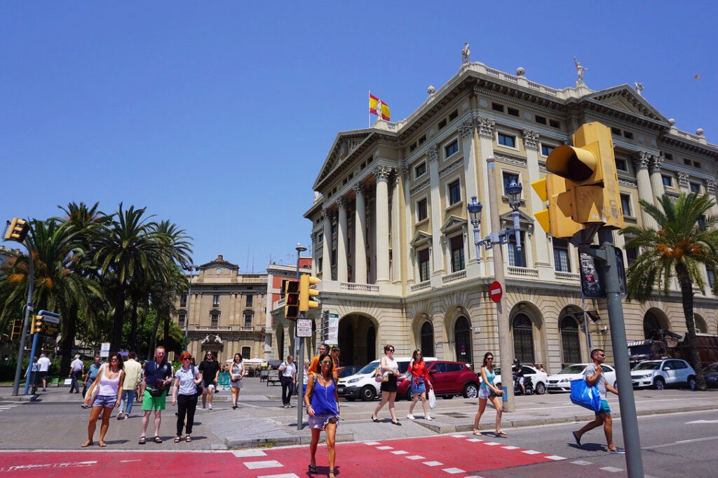 busy public street in barcelona on a summer day