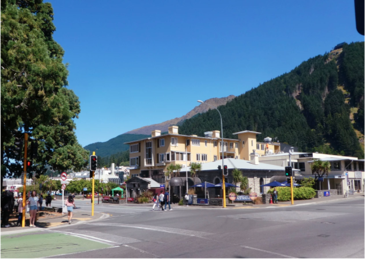 yellow building in front of street without cars