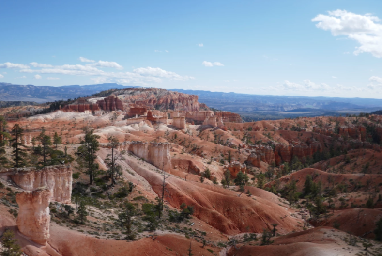 overview of red rock mountains in bryce canyon with rolling landscape