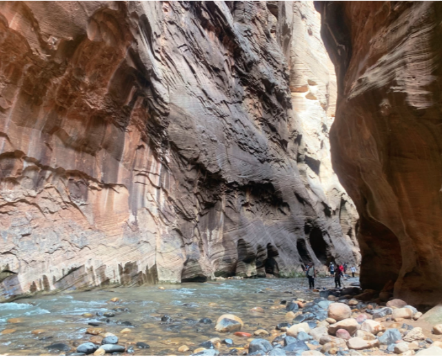 stones in river water with rock walls