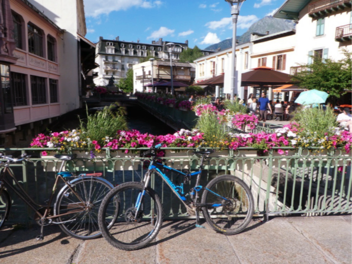 bike in chamonix leaning against the river fence
