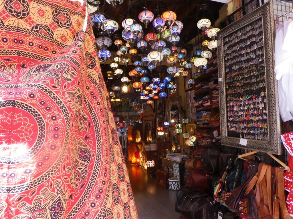 colorful lanterns hanging from ceiling in a street store