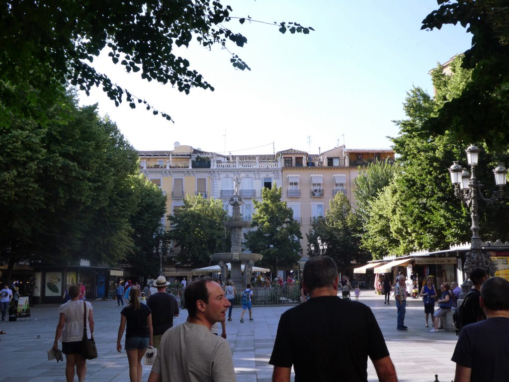 people walking in a plaza