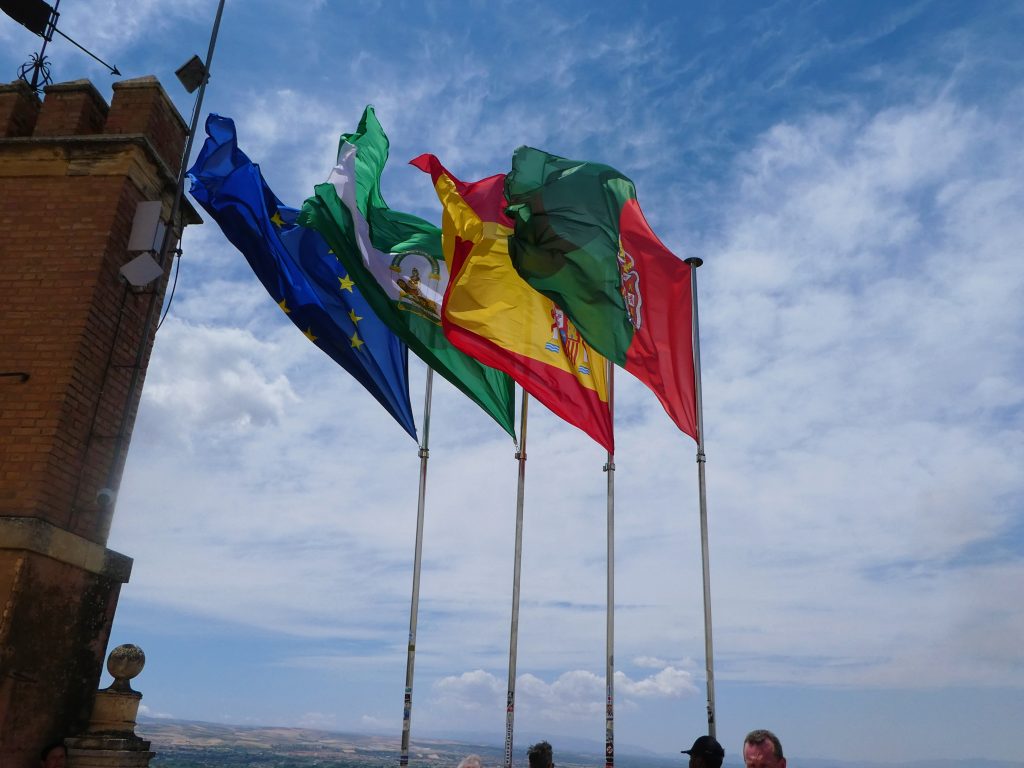 four flags at the torre de la vela blowing in the wind