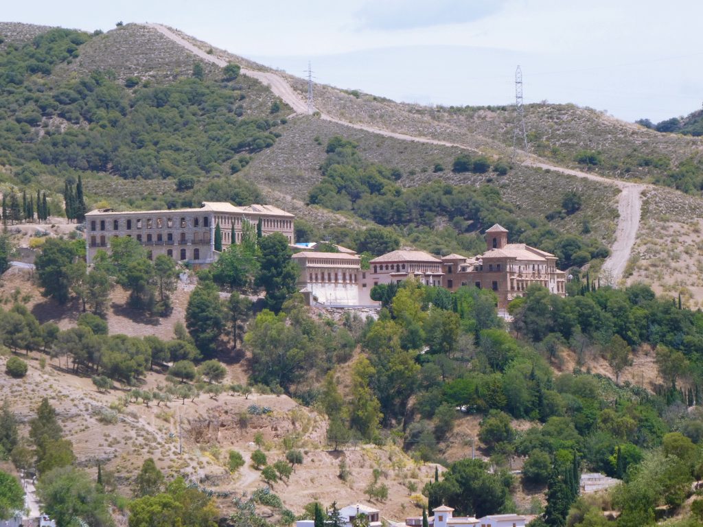 royale palace of granada as seen from across the hills