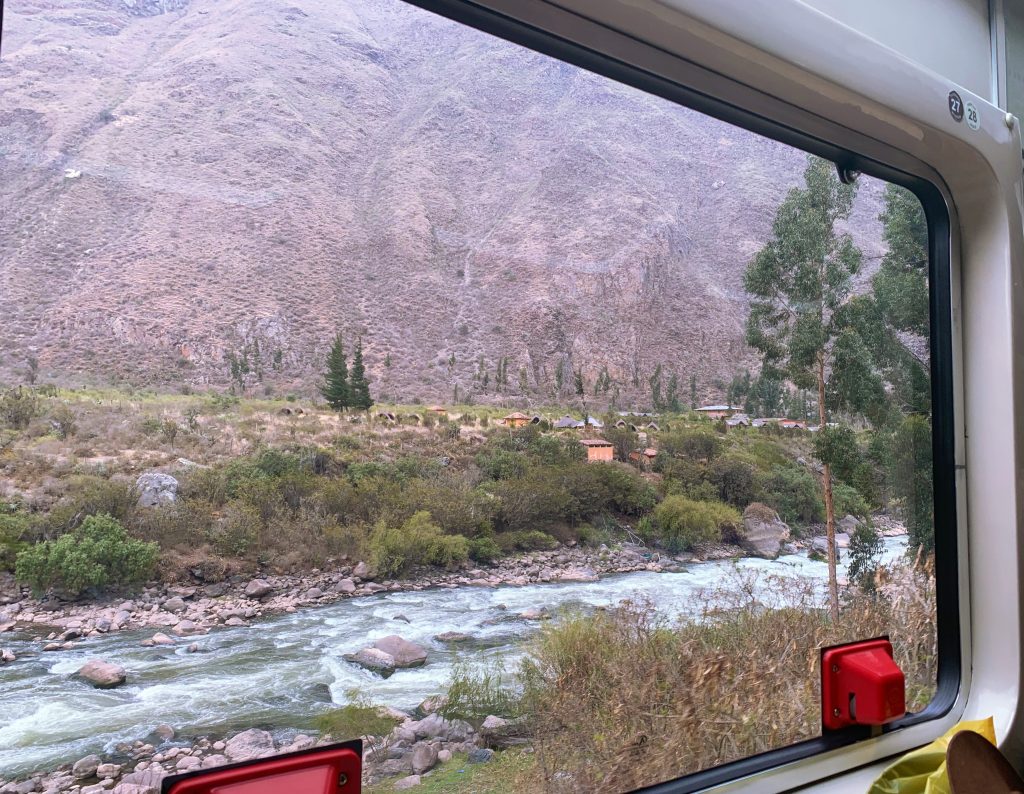 views of the Inca Trail out the window from a train