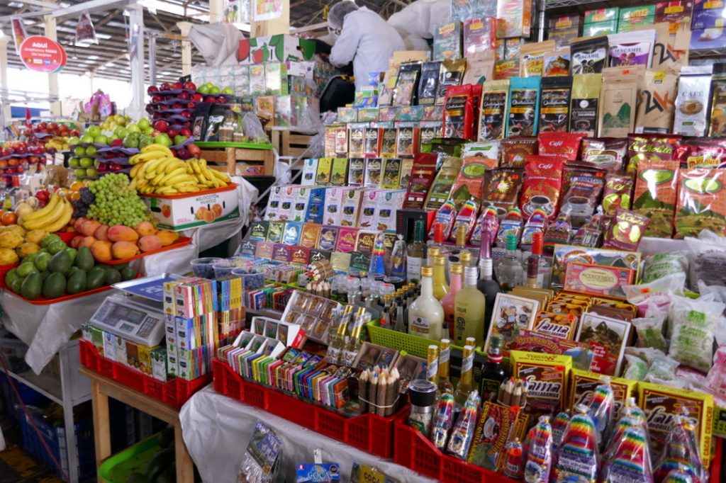 shelves of chocolate, packaged food, and souvenirs in the san pedro market
