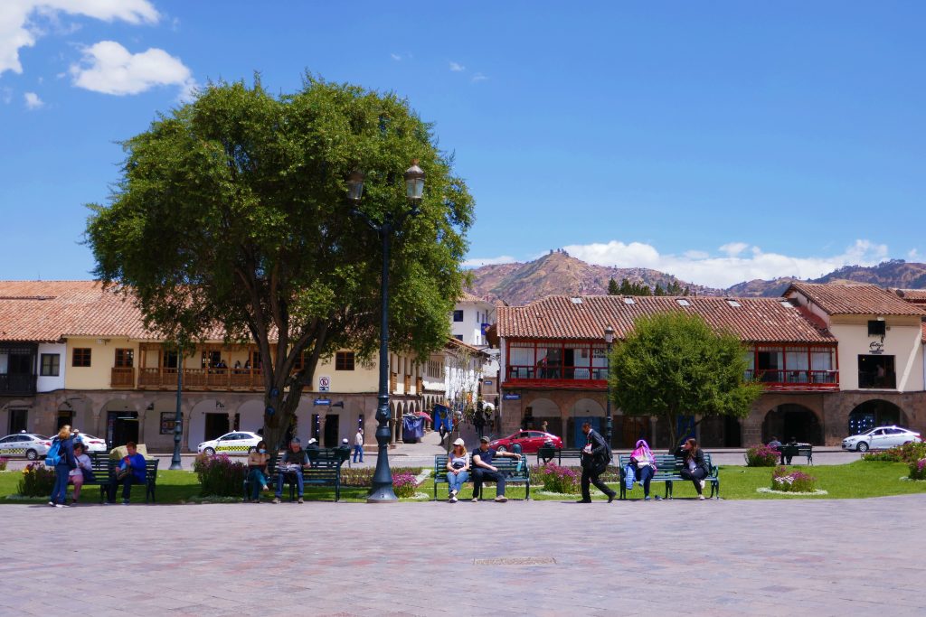 plaza de armas square with tree and people sitting