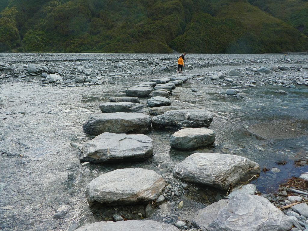 large rock path over the river to franz josef glacier