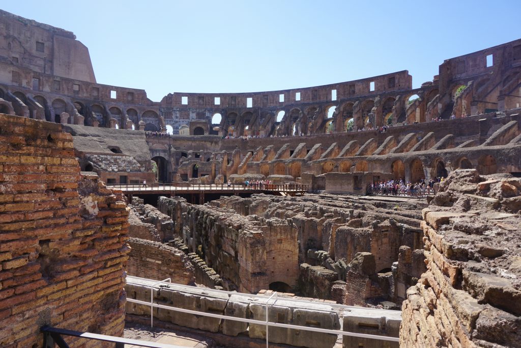 interior fighting area of the colosseum on sunny day