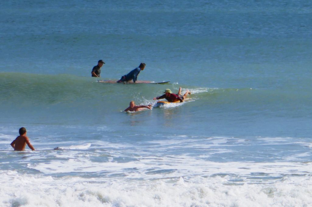 group of surfers in the ocean