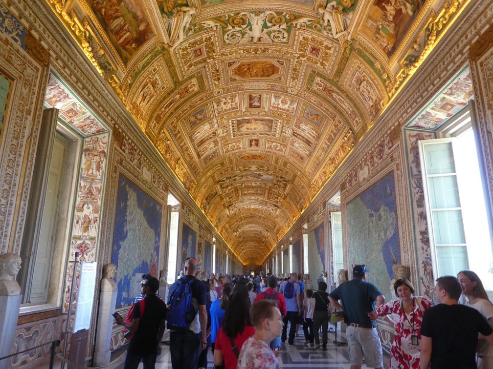 golden ceiling hallway leading to sistine chapel