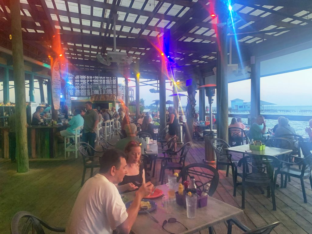 people sitting under covering in outdoor restaurant
