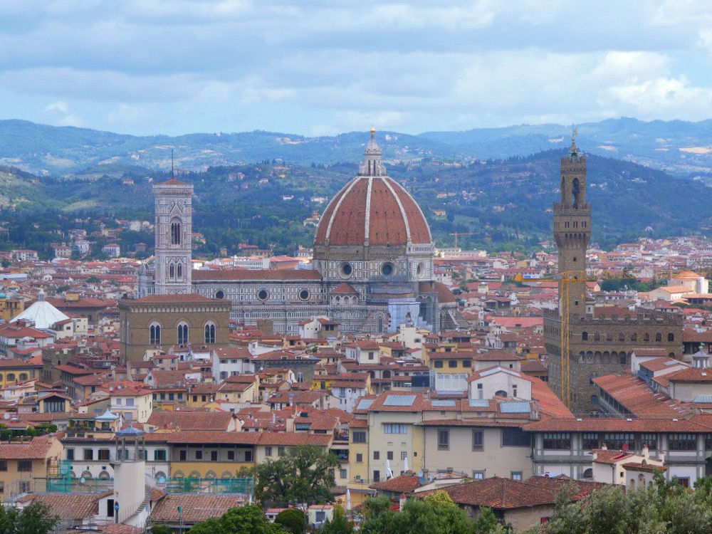 florence skyline with red roof houses and close up of the duomo