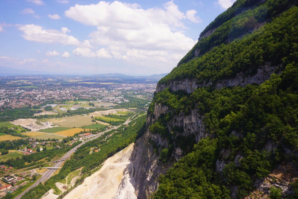 steep side of green mountain with stone