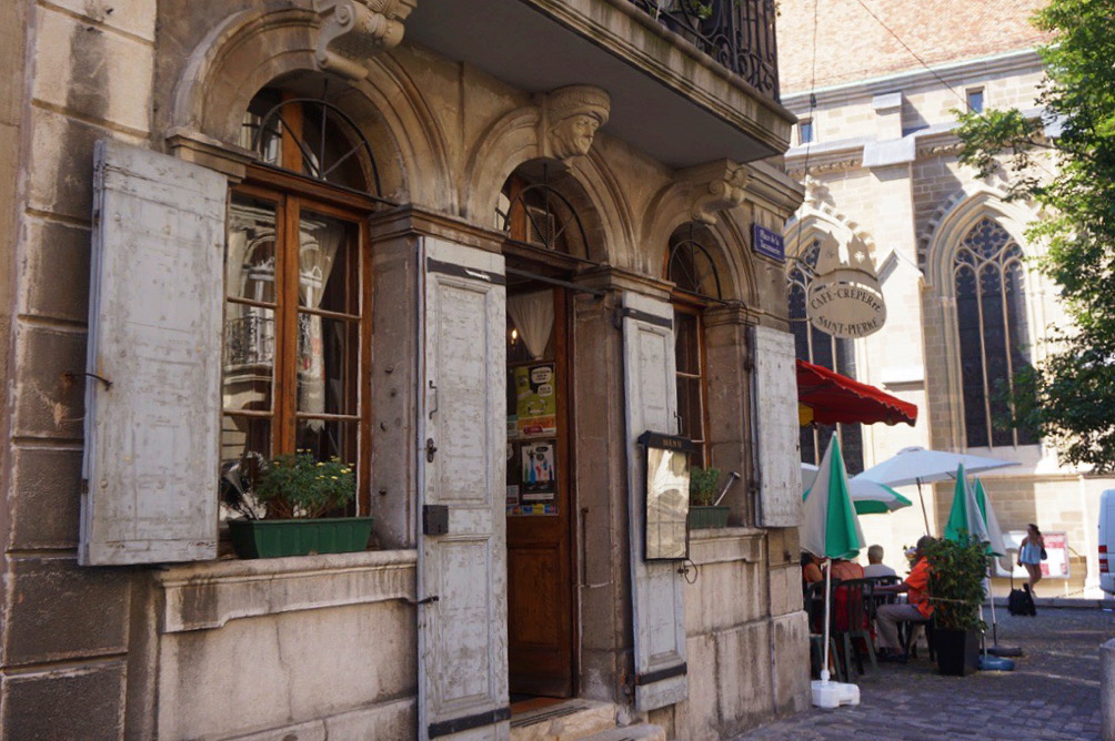 arched door and windows on stone building