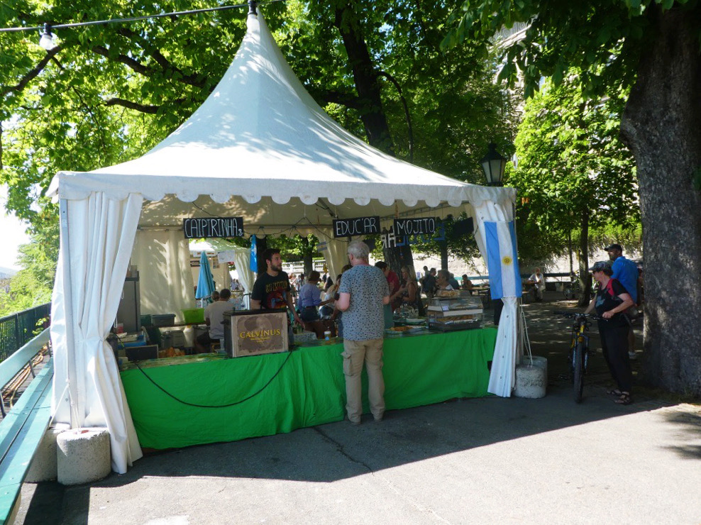 man buying gifts from a white tent