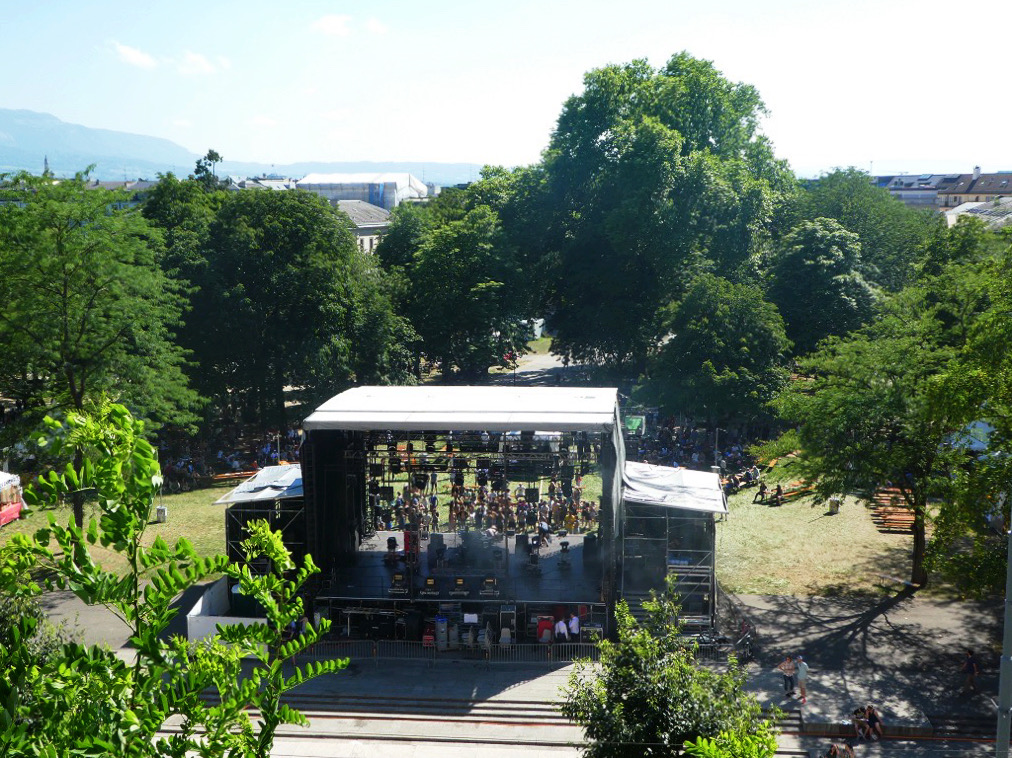 outdoor stage in front of trees