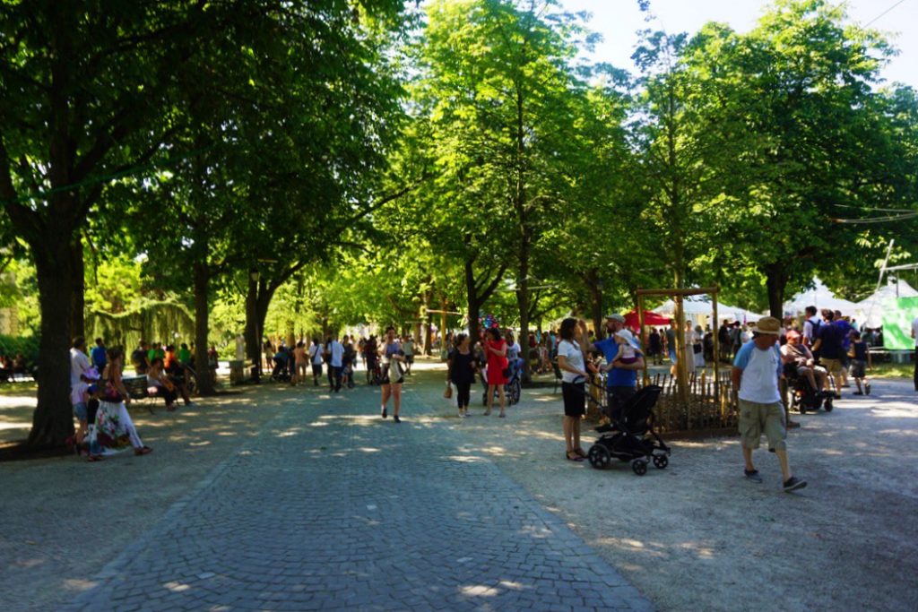 people in an open plaza fair