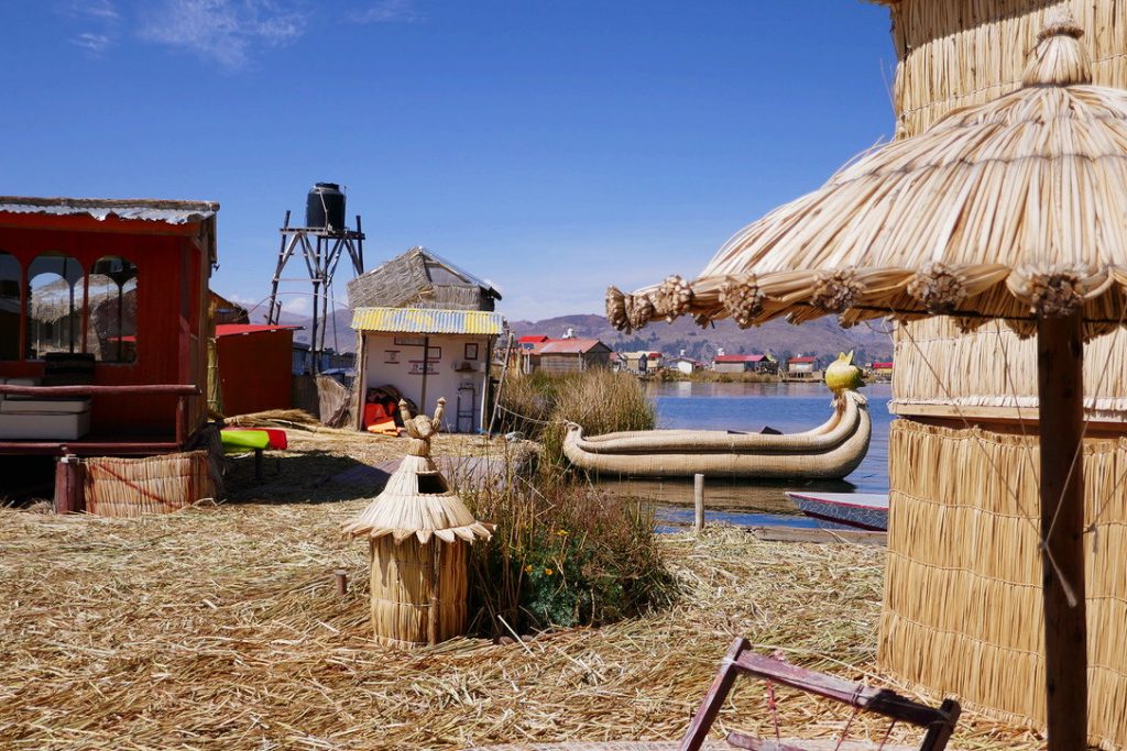 hand crafted objects made of totora reeds and hay on the floating island of uros