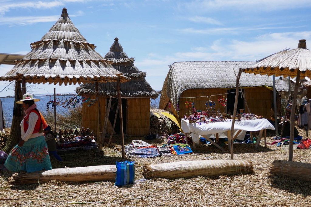 souvenir stands and traditional houses on the floating islands of uros