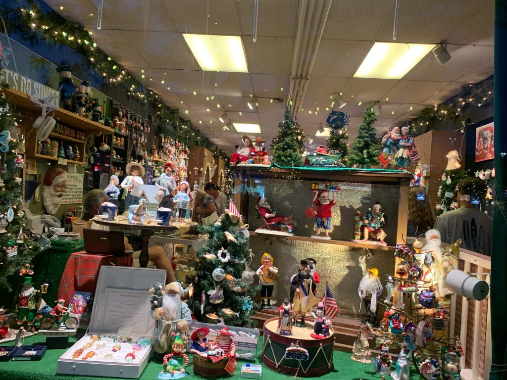 christmas decorations in the window of paisleys christmas shop