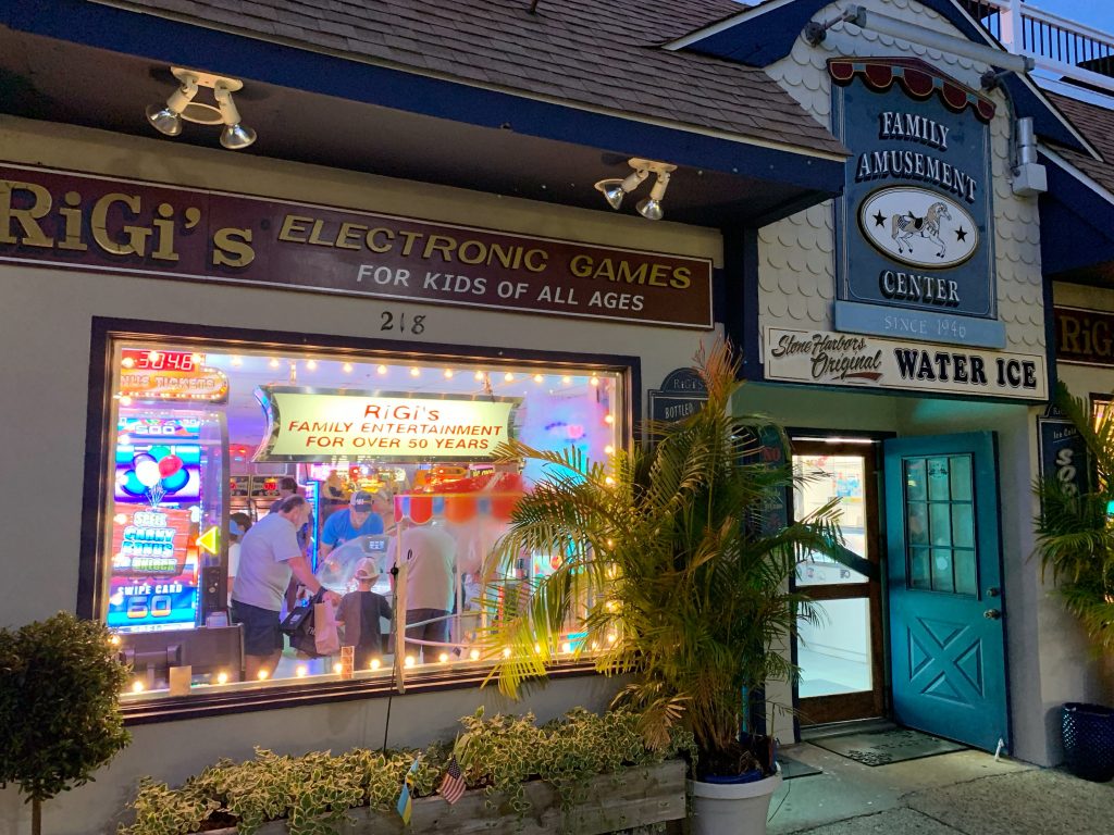 view of family playing games inside rigi's arcade amusement center