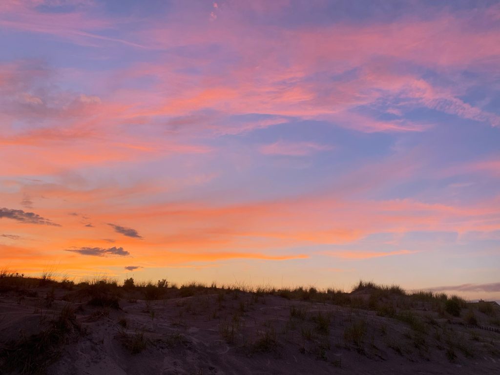 vibrant sunset above the dunes on stone harbor beach