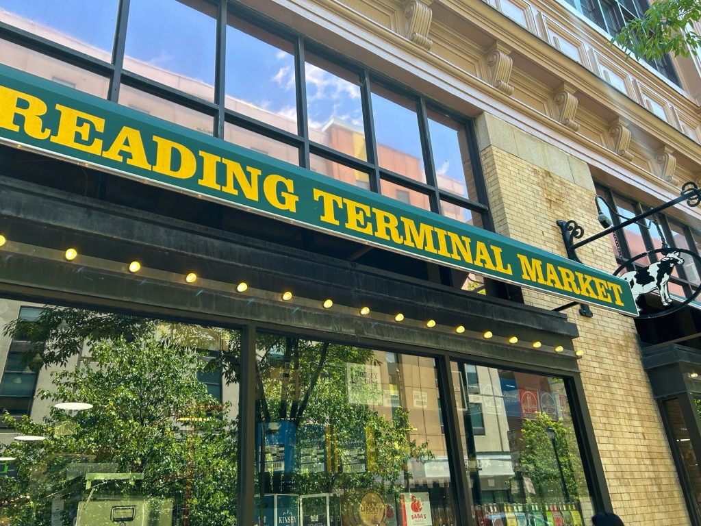 green and yellow entrance sign of reading terminal market