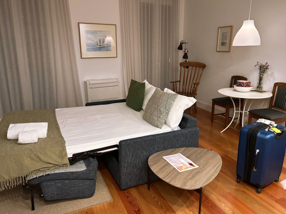 pull out couch in the living area of good memories lodge