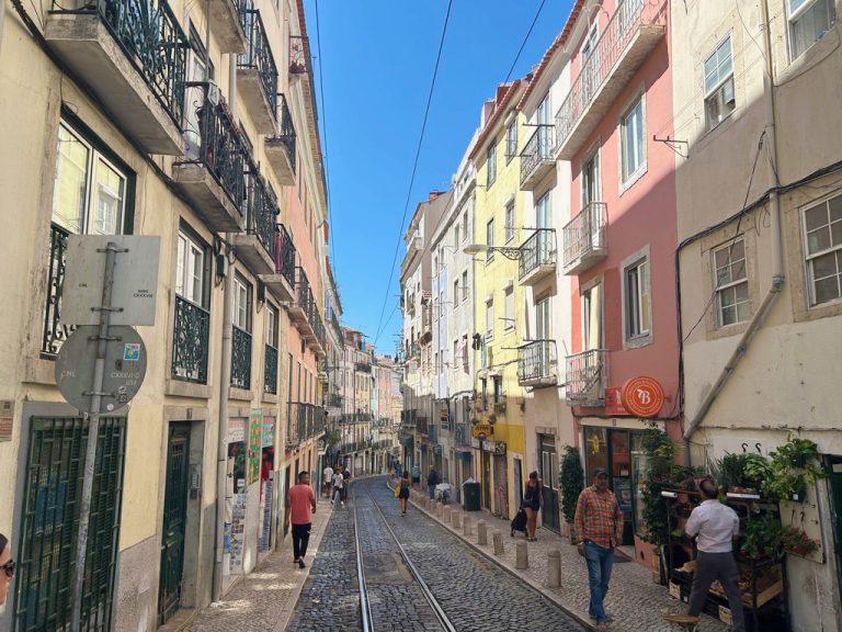 colorgul yellow and pink buildings on the street of lisbon