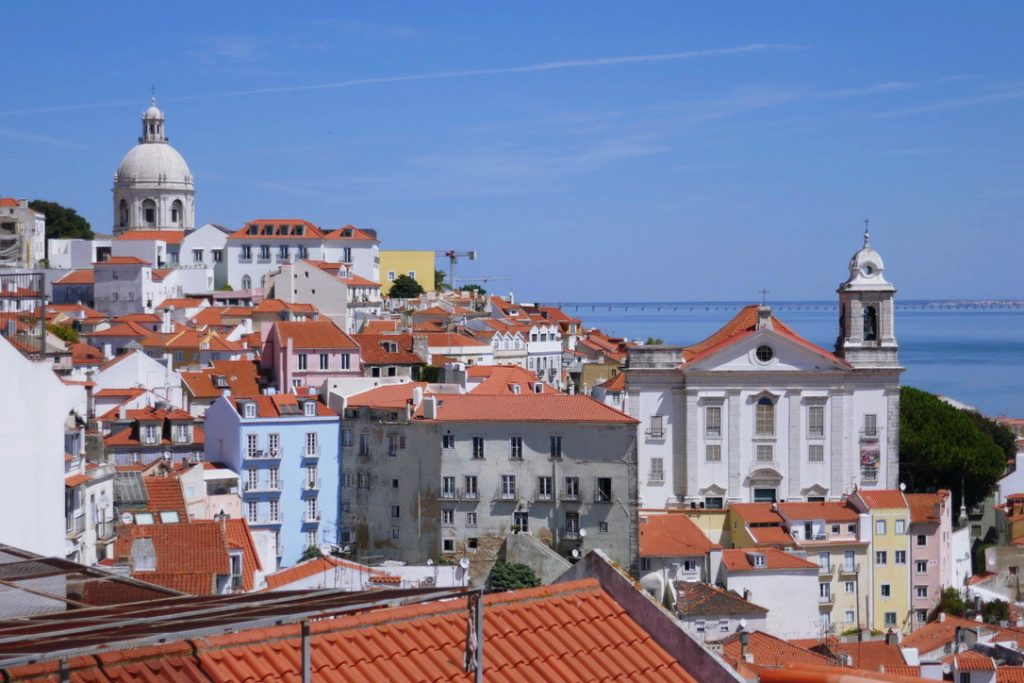 red and white buildings in lisbon portugal