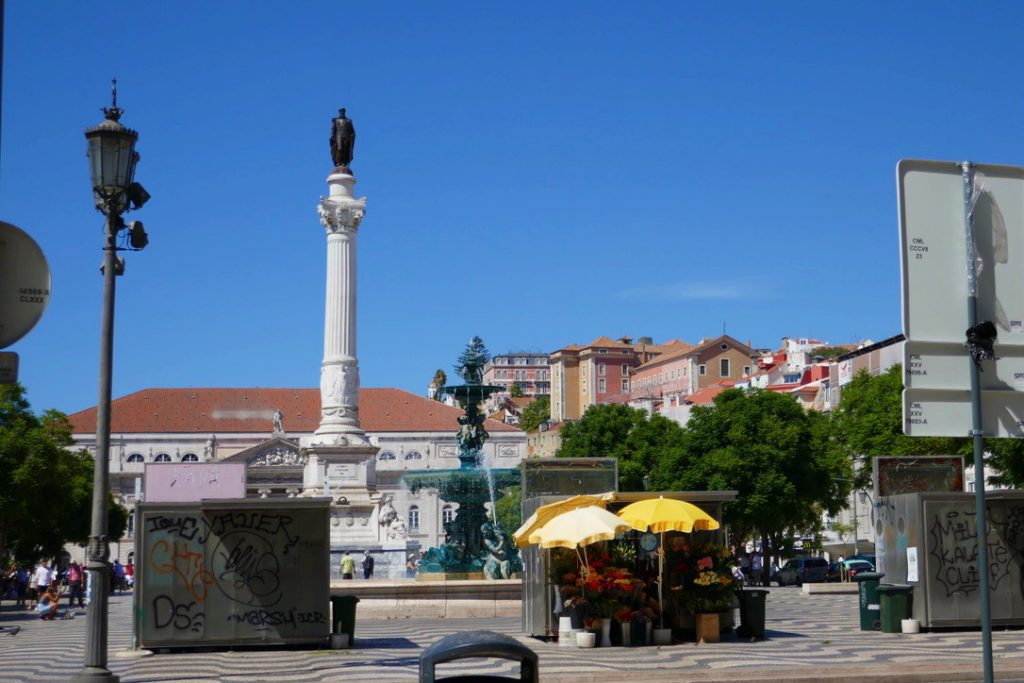 tall statue of a man in lisbon portugal