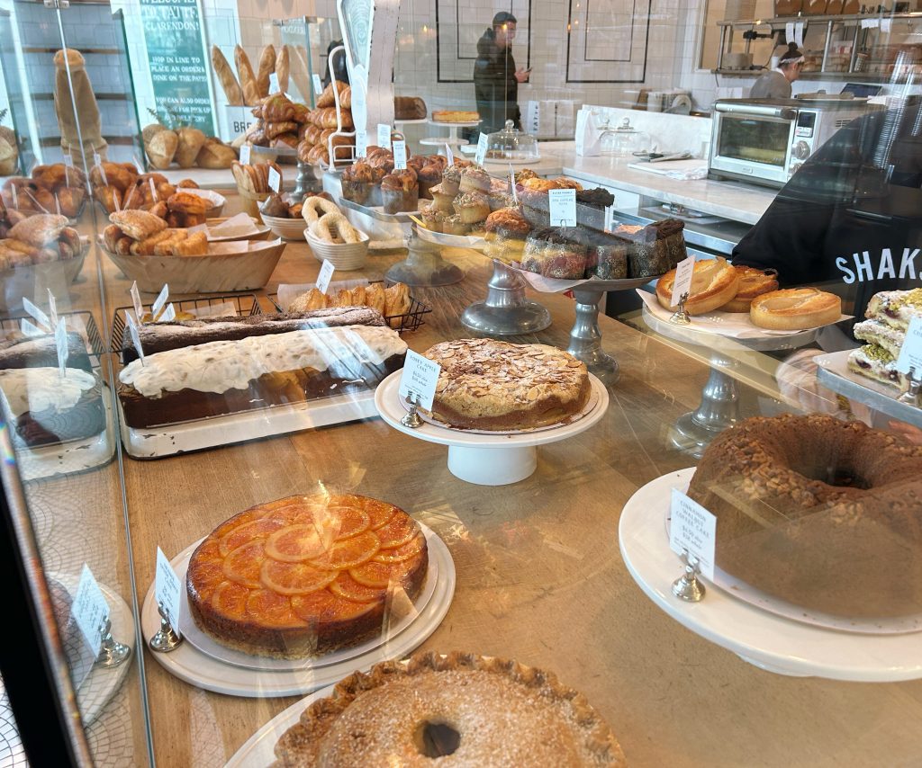 pies, bundt cakes, and baked goods on a counter at tatte's