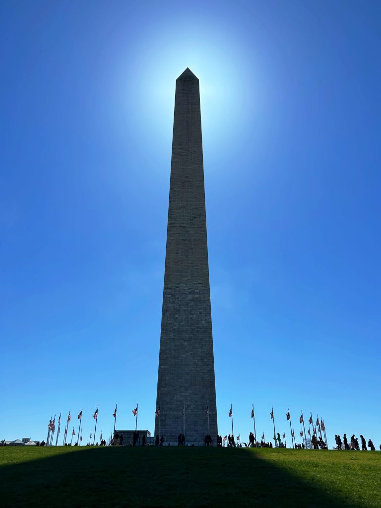 the washington monument blocking the sun at noon