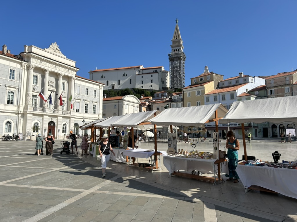 local vendor tents in tartini square of piran