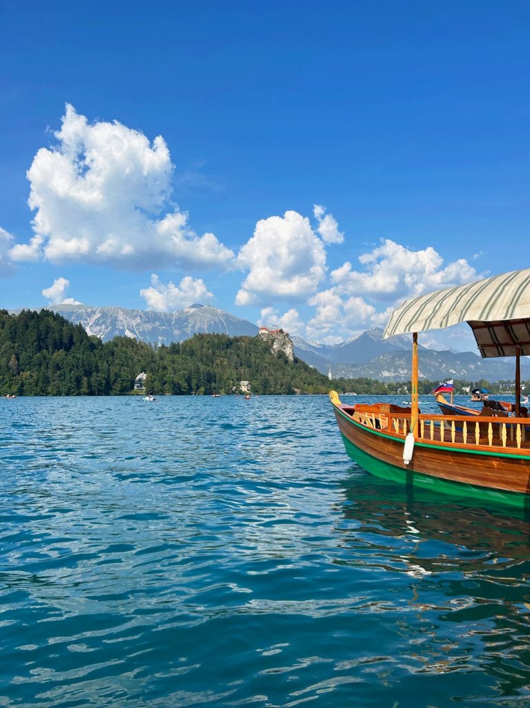 pletna boat parked on lake bled on clear day