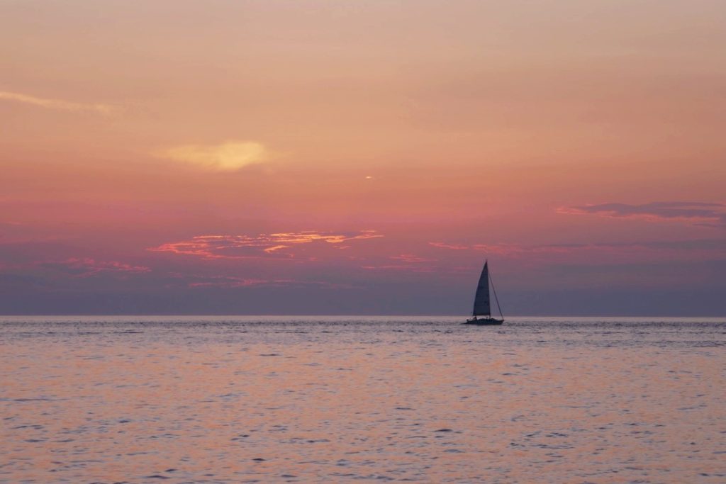 sailboat at sunset in piran slovenia