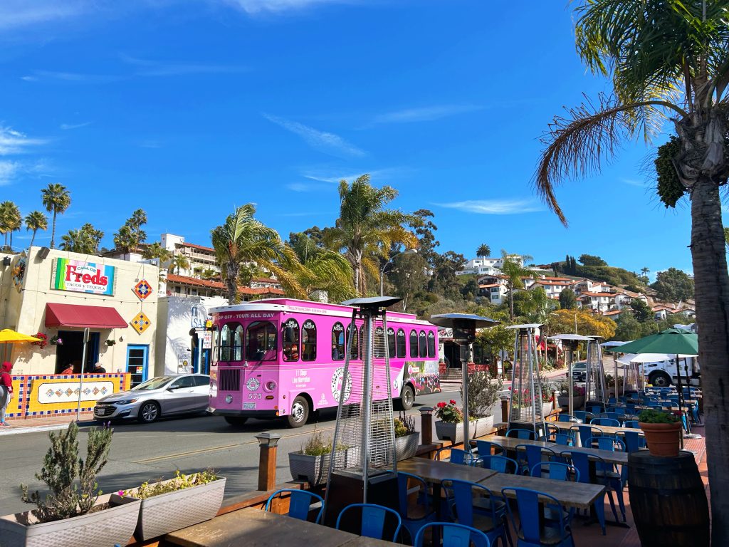 pink old town trolley in old town san diego california on a nice day